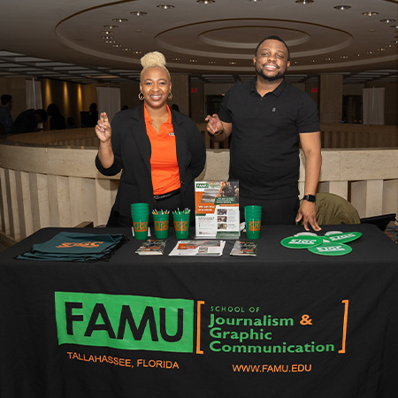 SJGC students at booth with FAMU swag