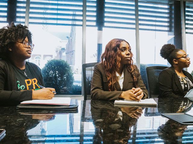 Public relations students in meeting room