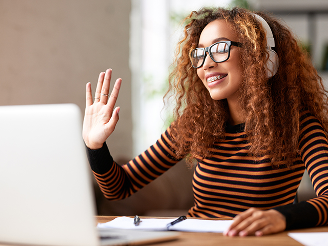 Young woman having an online meeting on a laptop